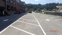 July 2017 - Repairs and striping of parking lot on north side of 115 River Road building