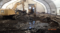 July 2020 - Clearing the Foundation of the Former 115 River Road Building inside the Central Tent